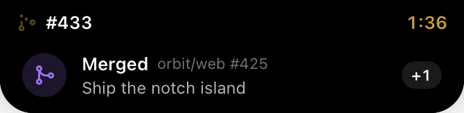 A banner sliding out of the notch: Merged, Ship the notch island